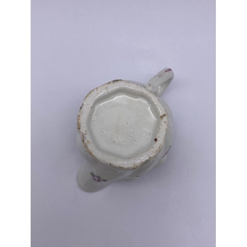 459 - 18TH CENTURY WRYTHEN MOULDED CREAM JUG WITH FLORAL SPRAY DECORATION