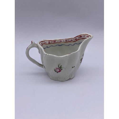 459 - 18TH CENTURY WRYTHEN MOULDED CREAM JUG WITH FLORAL SPRAY DECORATION