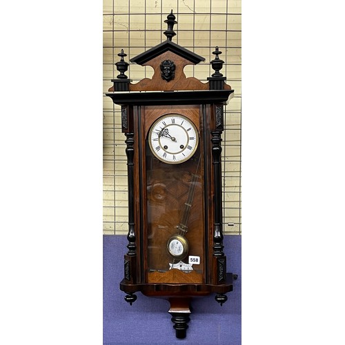 558 - 19TH CENTURY WALNUT CASED PENDULUM VIENNA TYPE WALL CLOCK WITH CRESTED PENDIMENT