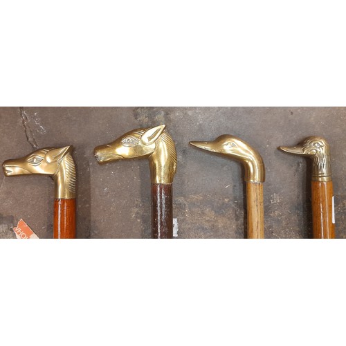 451 - FOUR BRASS HORSE AND DUCK HEAD FINIAL WALKING CANES