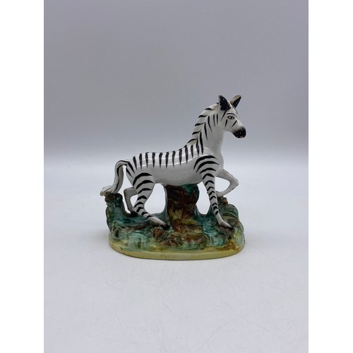 529 - 19TH CENTURY STAFFORDSHIRE FIGURE OF A ZEBRA