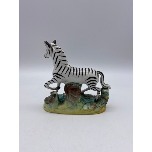 529 - 19TH CENTURY STAFFORDSHIRE FIGURE OF A ZEBRA