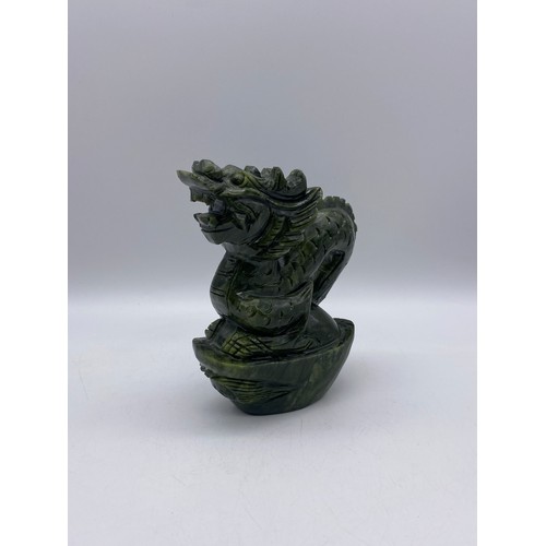 524 - CHINESE CARVED GREEN SOAP STONE DRAGON ON ROCK FIGURE