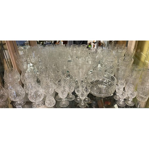 519 - GOOD QUALITY SUITES OF CUT GLASSWARE ETCHED WITH CHINESE FISHERMAN AND PAGODAS INCLUDING FLUTES, TUM... 