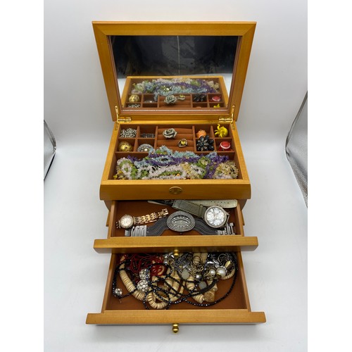 573 - LIGHT WOOD JEWELLERY BOX CONTAINING VARIOUS COSTUME JEWELLERY BEAD NECKLACES, WRIST WATCHES