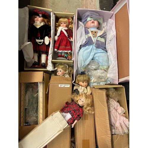 301 - LARGE QUANTITY OF BOXED PORCELAIN HEADED DRESS DOLLS