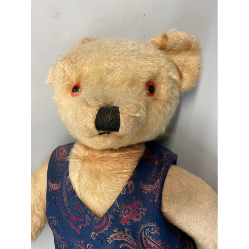 299 - PLUSH MO HAIR MID 20TH CENTURY TEDDY BEAR DRESSED IN WAISTCOAT AND VELVET TROUSERS