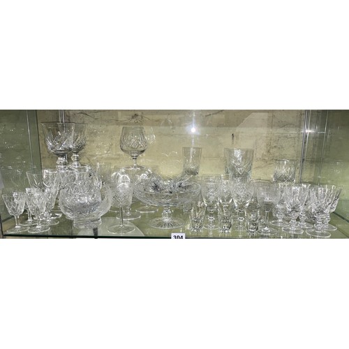 304 - SHELF OF CUT GLASS INCLUDING TUMBLERS, GOBLETS AND PEDESTAL BOWL