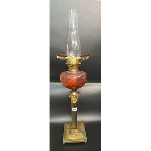 230 - CORINTHIAN COLUMN AND RED GLASS RESERVOIR OIL LAMP