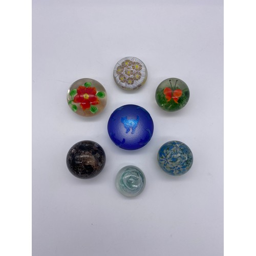 402 - SEVEN MINIATURE GLASS PAPERWEIGHTS INCLUDING A SOLERA IRIDESCENT OVERLAY CAT SILHOUETTE EXAMPLE