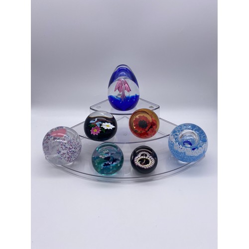 403 - SHELF OF CAITHNESS GLASS PAPERWEIGHTS INCLUDING WEDDING DAY, FAE PINK, ROLLING SURF DOLPHIN, RED POP... 