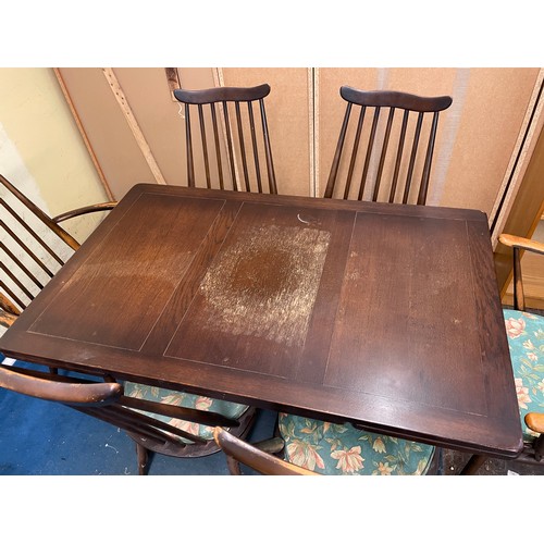 34 - ERCOL TRESTLE END DRAWER LEAF TABLE AND SIX SPINDLE BACK CHAIRS