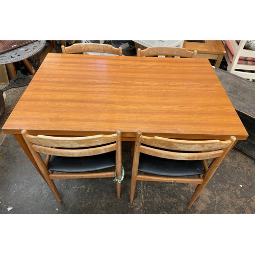 114 - CENTA WOOD EFFECT FORMICA DINING TABLE AND FOUR DINING CHAIRS