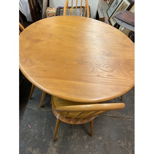 112 - ERCOL LIGHT ELM DROP FLAP TABLE AND FOUR STICK BACK CHAIRS