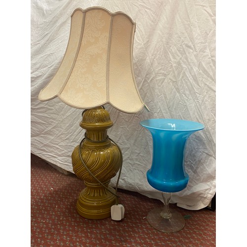 483 - POTTERY MUSTARD MOULDED TABLE LAMP AND LARGE FLARED BLUE GLASS VASE