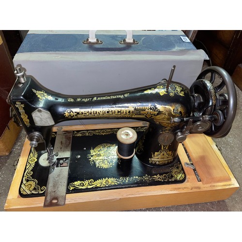 125 - CASED SEWING MACHINE