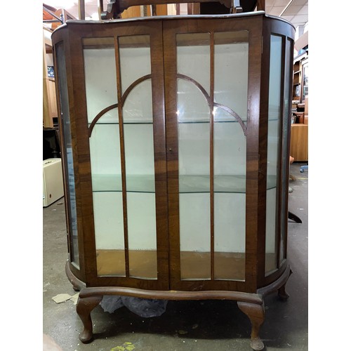 131 - WALNUT SERPENTINE FRONTED GLAZED CABINET