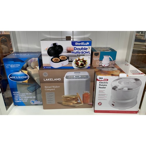 393 - BOXED ELECTRIC POTATOE PEELER, DOUBLE WAFFLE MAKER, BREAD MAKER, AND FOLDING KETTLE