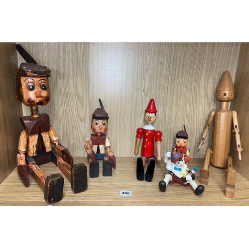 406 - SHELF OF CARVED AND PAINTED PINOCCHIO DOLL FIGURES