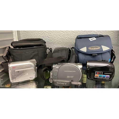 421 - CANON MV901 CAMCORDER, SONY HANDY CAM, CARRY CASES AND RELATED ITEMS