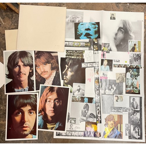 557 - THE BEATLES THE WHITE ALBUM WITH POSTER AND FOUR PORTRAIT PHOTOGRAPHS NUMBER 140239