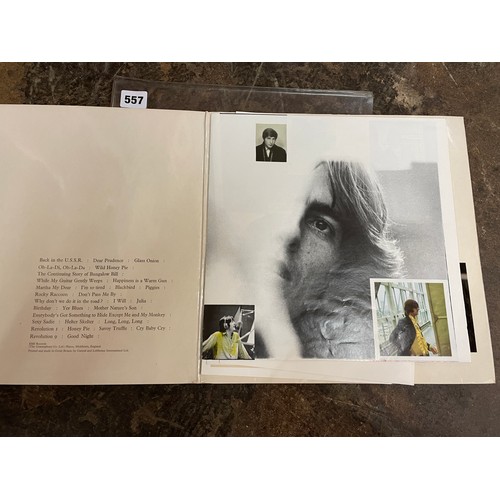 557 - THE BEATLES THE WHITE ALBUM WITH POSTER AND FOUR PORTRAIT PHOTOGRAPHS NUMBER 140239