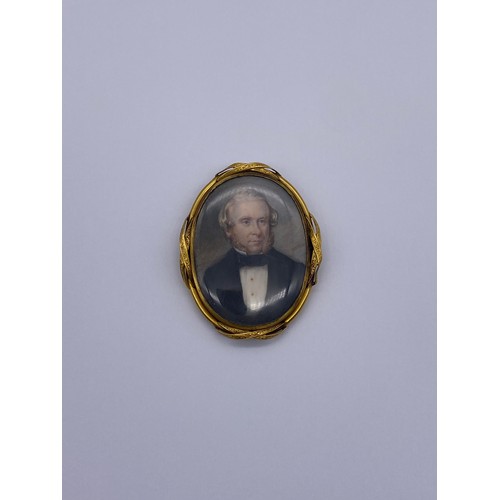 596 - 19TH CENTURY GILT METAL MOUNTED OVAL PORTRAIT MINIATURE OF GENTLEMAN WEARING A DICKIE BOW INSCRIBED ... 