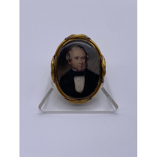 596 - 19TH CENTURY GILT METAL MOUNTED OVAL PORTRAIT MINIATURE OF GENTLEMAN WEARING A DICKIE BOW INSCRIBED ... 