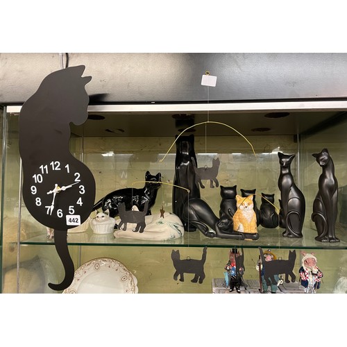 442 - SHELF OF RESIN AND POTTERY CAT FIGURES AND BATTERY OPERATED CAT CLOCK AND MOBILE