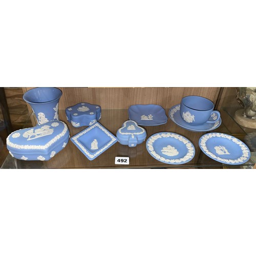 492 - SHELF OF WEDGWOOD POWDER BLUE JASPERWARE CIRCULAR AND LOZENGE SHAPE PIN DISHES, HEART SHAPE BOX, AND... 