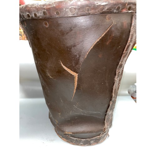 570 - DISTRESSED ANTIQUE LEATHER BUCKET WITH ROYAL COAT OF ARMS