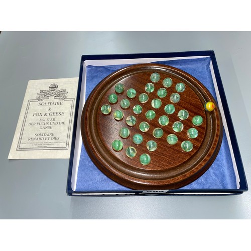 585 - BOXED HOUSE OF MARBLES SOLITAIRE BOARD AND MARBLES