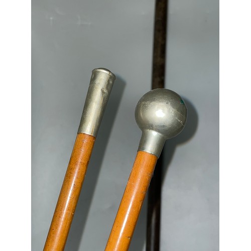 607 - TWO METAL MOUNTED MILITARY SWAGGER STICKS AND SERGEANT MAJORS ROD