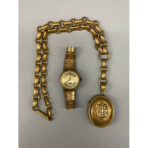 689 - GILT METAL OVAL LOCKET ON HEAVY LINK CHAIN AND A GILT METAL STRAP LADIES WRISTWATCH