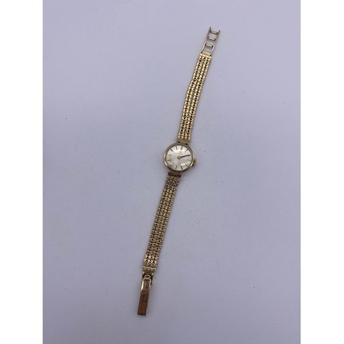 673 - LADIES 9CT GOLD TISSOT WRISTWATCH ON 9CT GOLD STRAP 19.2 G APPROX