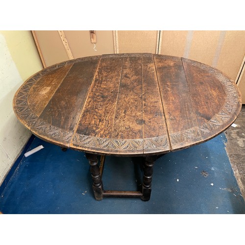 37 - 18TH CENTURY OAK DROP FLAP GATE LEG TABLE WITH LATER CARVED TOP