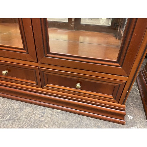 97 - G PLAN CHERRY WOOD THREE DOOR DISPLAY CABINET WITH DRAWER BASE