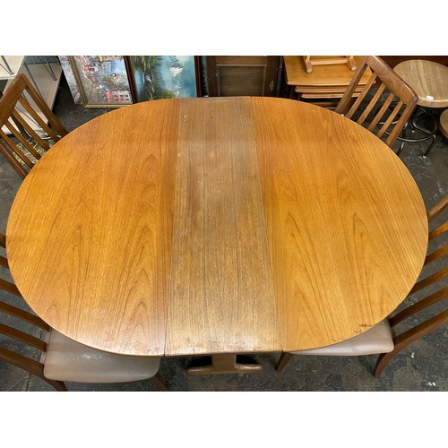 111 - TEAK OVAL DINING TABLE AND FOUR CHAIRS