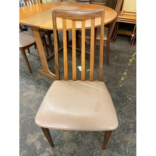 111 - TEAK OVAL DINING TABLE AND FOUR CHAIRS