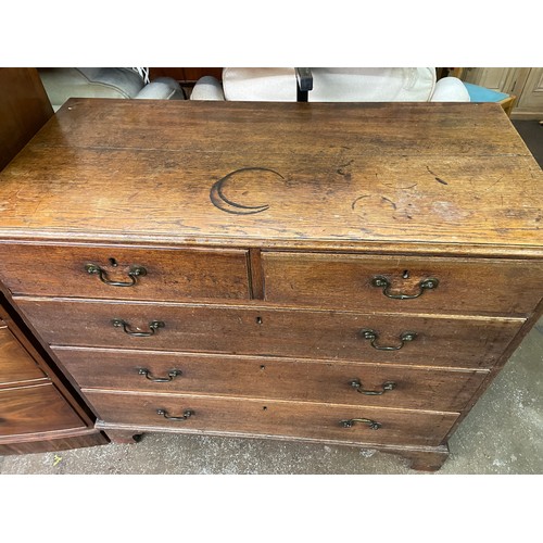 83 - GEORGE III OAK TWO OVER THREE DRAWER CHEST ON BRACKET FEET