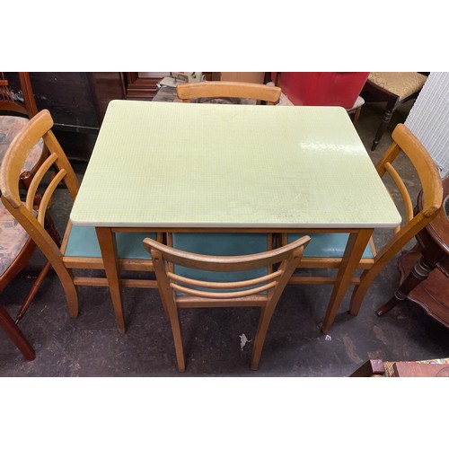 58 - 1960S YELLOW CHEQUERED FORMICA TOPPED KITCHEN TABLE AND FOUR CHAIRS