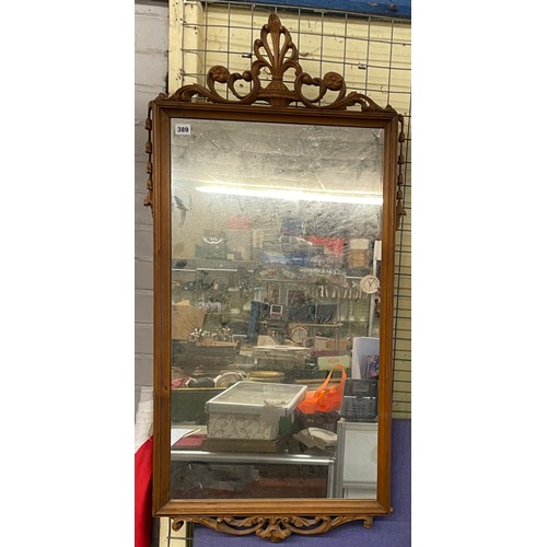 430 - CARVED WOODEN CRESTED AND BELL HUSK RECTANGULAR MIRROR