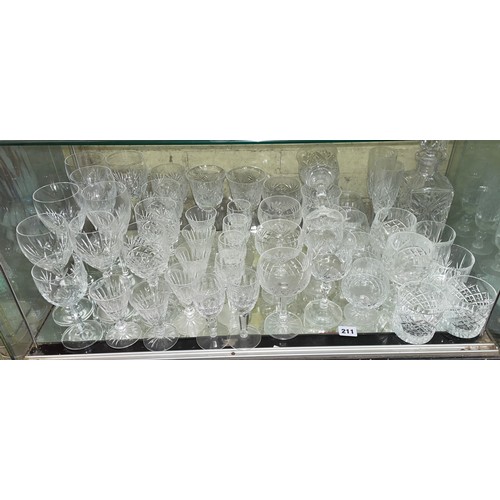 211 - SHELF OF CUT GLASS INCLUDING WATERFORD GOBLETS, ROYAL BRIERLEY WINE GLASSES, STUART TUMBLERS, AND GA... 