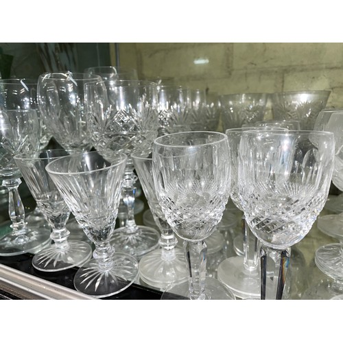 211 - SHELF OF CUT GLASS INCLUDING WATERFORD GOBLETS, ROYAL BRIERLEY WINE GLASSES, STUART TUMBLERS, AND GA... 