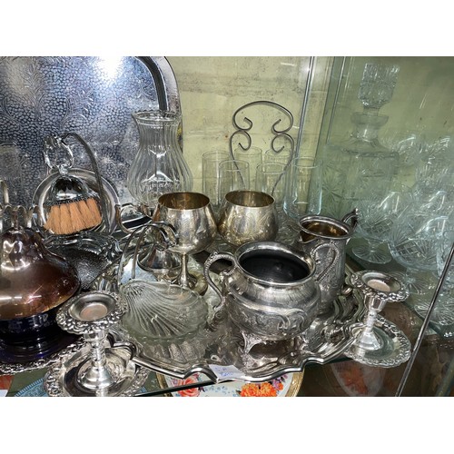 219 - SHELF OF EPNS WARES INCLUDING TWIN SECTION TANTALUS, PRESERVE JARS, CRUMB TRAY, CANDLE STICKS, AND C... 