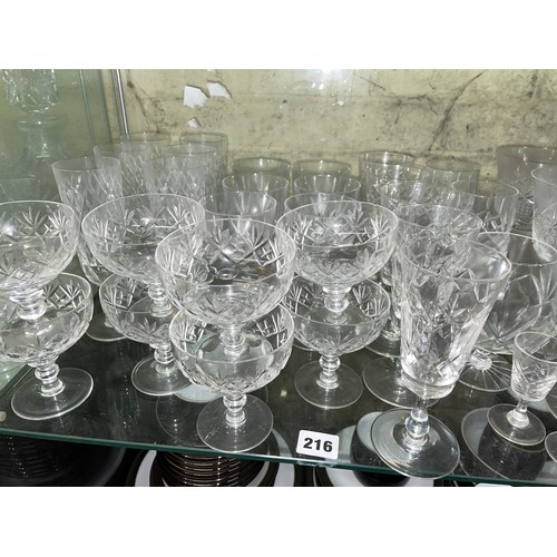 216 - SHELF OF CUT GLASSWARE INCLUDING ROYAL DOULTON SUNDAE DISHES, ROYAL BRIERLEY FLUTES, DECANTERS AND T... 