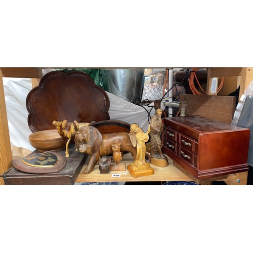 228 - SHELF OF TREEN ITEMS INCLUDING LOBED SERVING TRAY, LION FIGURE, COMPARTMENTED TRINKET BOX, AND PAIR ... 