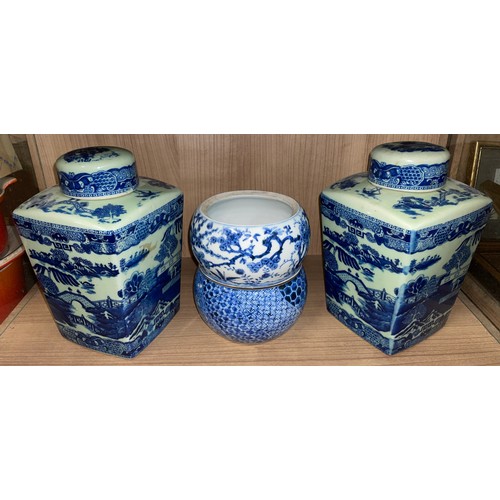 371 - PAIR OF VICTORIA WARE BLUE AND WHITE TRANSFER PRINTED CHINESE INSPIRED PANELLED JARS WITH COVERS