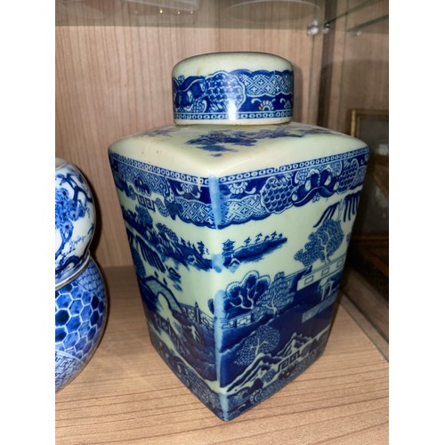 371 - PAIR OF VICTORIA WARE BLUE AND WHITE TRANSFER PRINTED CHINESE INSPIRED PANELLED JARS WITH COVERS