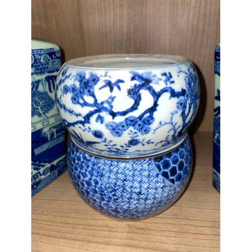 371 - PAIR OF VICTORIA WARE BLUE AND WHITE TRANSFER PRINTED CHINESE INSPIRED PANELLED JARS WITH COVERS